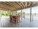 Charming outdoor patio with ample seating and a dining area offers stunning waterfront views at 9172 W Tulip Dr, Columbus, IN 47201