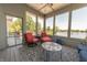 Bright sunroom with scenic lake views, offering a peaceful retreat for relaxation and enjoyment at 9172 W Tulip Dr, Columbus, IN 47201