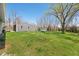 Spacious backyard features lush lawn and mature trees. with detached garage at 9267 N State Road 135, Morgantown, IN 46160