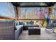 Inviting outdoor deck featuring comfortable seating, rocking chairs, a table, with serene backyard views at 9267 N State Road 135, Morgantown, IN 46160