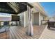 Inviting outdoor deck featuring comfortable seating, a grill, string lights, and a mounted TV, perfect for entertaining at 9267 N State Road 135, Morgantown, IN 46160