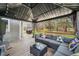 Inviting outdoor deck featuring comfortable seating, table, string lights, perfect for entertaining with serene backyard views at 9267 N State Road 135, Morgantown, IN 46160