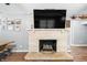 Living room with a beautiful white brick fireplace and hardwood floors at 9267 N State Road 135, Morgantown, IN 46160