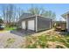 Spacious detached two car garage with gravel driveway and additional parking, offering ample space for vehicles and storage at 9267 N State Road 135, Morgantown, IN 46160
