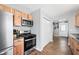 The kitchen has modern stainless steel appliances, custom cabinets, and hardwood floors at 9267 N State Road 135, Morgantown, IN 46160