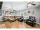 Spacious living room featuring leather furniture, ceiling fans, and hardwood flooring at 9267 N State Road 135, Morgantown, IN 46160