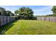 Well maintained large backyard enclosed by a wooden fence. Beautiful trees and landscaping at 9497 W Stargazer Dr, Pendleton, IN 46064