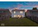 Backyard with green grass, patio, and privacy fence viewed at twilight at 9497 W Stargazer Dr, Pendleton, IN 46064