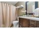 Bathroom showcasing a vanity, mirror, and shower with neutral tone at 9497 W Stargazer Dr, Pendleton, IN 46064