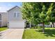 Charming two-story home with gray siding, a two-car garage, and a well-maintained front lawn at 9497 W Stargazer Dr, Pendleton, IN 46064