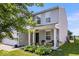 Charming two-story home with gray siding, a two-car garage, and a well-maintained front lawn at 9497 W Stargazer Dr, Pendleton, IN 46064