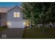 Charming two-story home with gray siding, a two-car garage, and a well-maintained front lawn at 9497 W Stargazer Dr, Pendleton, IN 46064