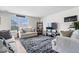 Spacious living room with plush carpet, comfortable sofas, and plenty of natural light at 9497 W Stargazer Dr, Pendleton, IN 46064