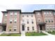 Charming brick townhouses feature well-maintained landscaping and inviting entrances at 954 Yorkshire Ln, Zionsville, IN 46077