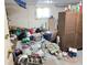 Unfinished basement with clutter and basic necessities at 9842 N State Road 9, Pendleton, IN 46064