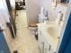 A bathroom featuring a single sink vanity, a toilet, and linoleum flooring at 9842 N State Road 9, Pendleton, IN 46064