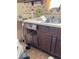 An interior view of a kitchen sink and drawers, along with other kitchen items at 9842 N State Road 9, Pendleton, IN 46064