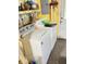 Laundry room with washer and dryer, storage shelves and yellow walls at 9842 N State Road 9, Pendleton, IN 46064