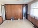 A vacant living room featuring light-colored walls, wood paneling, and a window at 9842 N State Road 9, Pendleton, IN 46064