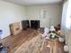 A vacant living room featuring hardwood floors, light-colored walls, and a large window at 9842 N State Road 9, Pendleton, IN 46064