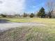 Vacant land shows promise with mature trees and a paved drive extending into the spacious lot at 9842 N State Road 9, Pendleton, IN 46064