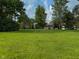 The house with the well-maintained lawn and trees in the backyard at 9947 Comb Run Ct, Avon, IN 46123