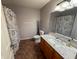 Well-lit bathroom features a modern sink, granite countertop, and coordinated shower curtain at 9947 Comb Run Ct, Avon, IN 46123