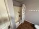 Bathroom shower/tub combo with a floral shower curtain and neutral walls at 9947 Comb Run Ct, Avon, IN 46123