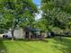 Exterior view of the house from the backyard with a wooden deck at 9947 Comb Run Ct, Avon, IN 46123