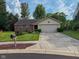 Well-maintained home featuring a two-car garage, manicured lawn, and attractive landscaping at 9947 Comb Run Ct, Avon, IN 46123