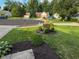 Lush front yard featuring manicured shrubs, mulch beds, and healthy green grass at 9947 Comb Run Ct, Avon, IN 46123