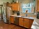 Updated kitchen featuring stainless steel appliances, granite countertops, and wooden cabinets at 9947 Comb Run Ct, Avon, IN 46123