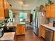 Open concept kitchen featuring wood cabinetry, stainless appliances and granite countertops at 9947 Comb Run Ct, Avon, IN 46123