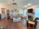 Cozy living room featuring a fireplace, hardwood flooring, and comfortable furniture at 9947 Comb Run Ct, Avon, IN 46123
