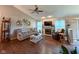 Bright living room showcasing hardwood floors, a fireplace, and a comfortable seating area at 9947 Comb Run Ct, Avon, IN 46123