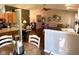 Open living room next to dining area, featuring vaulted ceiling, hardwood floors, and natural lighting at 9947 Comb Run Ct, Avon, IN 46123