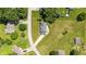 Bird's-eye view of a charming home with a well-maintained lawn and mature trees in a peaceful neighborhood at 1011 Robin Dr, Anderson, IN 46013