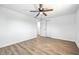 Bedroom with wood-look floors, ceiling fan, closet and doorway at 1011 Robin Dr, Anderson, IN 46013