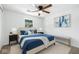Comfortable bedroom with ceiling fan, natural light, and stylish decor at 1011 Robin Dr, Anderson, IN 46013