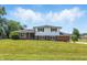 Charming two-story home with a well-maintained lawn and classic curb appeal on a sunny day at 1011 Robin Dr, Anderson, IN 46013