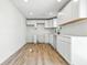 Updated kitchen featuring new white cabinets, countertops, and stylish fixtures, freshly painted at 1011 Robin Dr, Anderson, IN 46013