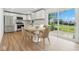 Eat-in kitchen featuring stainless appliances, white cabinetry, and sliding glass doors to the backyard at 1011 Robin Dr, Anderson, IN 46013