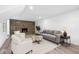 Living room featuring a brick fireplace, hardwood floors, recessed lighting, and comfortable furniture at 1011 Robin Dr, Anderson, IN 46013