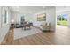Bright living room featuring hardwood floors, recessed lighting, and large windows with natural light at 1011 Robin Dr, Anderson, IN 46013