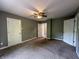 Cozy bedroom with plush carpet, neutral paint, and multiple doors for easy access at 1016 W 31St St, Indianapolis, IN 46208