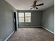 Bedroom with carpet, a ceiling fan and two windows at 1016 W 31St St, Indianapolis, IN 46208