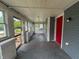 Enclosed front porch with multiple windows allowing for ample sunlight at 1016 W 31St St, Indianapolis, IN 46208