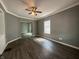 Spacious living room with dark hardwood floors and ceiling fan at 1016 W 31St St, Indianapolis, IN 46208