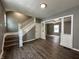 Living room with hardwood floors, staircase and ceiling fan at 1016 W 31St St, Indianapolis, IN 46208
