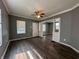 Bright living room featuring hardwood floors and ceiling fan at 1016 W 31St St, Indianapolis, IN 46208
